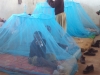 Kwela - Two younger pupils happily sit under their new nets.