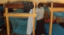 Kinampanda: One student installs her bednet.