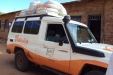 Wottaa - A truck filled with LLINs waits outside the school.