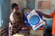 MPUNGUZI School Staff happily receives the nets for their students.