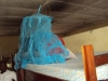 The girls at Nanguruwe Secondary school in Tanzania tuck in the edges of their new nets as they learn how they are used.