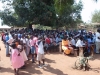 The villagers gather for the demonstration.