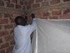 Volunteers help ensure that nets are hung properly.