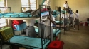 Mahiwa Sec: A dormitory space as of yet unprotected from malaria.