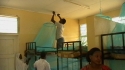 Mbekenyera Sec: A community effort in hanging the LLIN ensures their proper use.