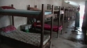 Mitole Agr Sec. School – A typical room shared by many students that was previously without nets