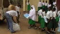 Mbekenyera Sec. School – Girls line up to claim their bed nets.