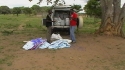 Mnara Sec. School - Volunteers unload nets from the packages filling the truck.