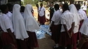 NGONGO SEC. SCHOOL: Students receive an education as to the proper hanging of a malaria protective net.