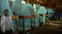 Rondo Seminary - Boys line up to show off their new LLINs.