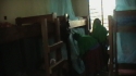 Ilulu Girls Sec : A net is carefully installed above each bed.