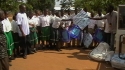 Barikiwa Sec : The mosquito nets are passed from the caregivers to the students.