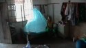 Kipatimu Sec : A young girl sits by her successfully installed LLIN.