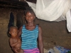 Mother and child with mosquito net up