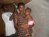Mother and child in front of assembled mosquito net