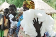 A woman holds tightly to her new anti-malarial netting.