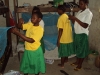 NANYAMBA SEC: Hanging and tying the needed strings, these young girls get to work on their malaria free project.