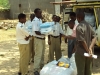 Mtwara Tech. Sec. - Volunteers pass out LLINs to students.