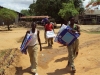 Mtwara Tech. Sec. - A group of students carries their new nets back to their dormitory.