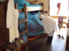 Mtwara Tech. Sec. - A student tucks the LLIN underneath her mattress to make sure it will protect her fully.