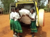 Students at Ndwika Girls Secondary school in Tanzania help unload the bednets that will hep them live longer, healthier lives.