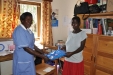 The sixth of six expectant mothers in today's clinic receiving a bed net.