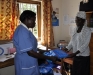 An expectant mother at the TSMP clinic receiving a bed net.