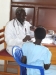 Dr. Eriamu Nathan interviews a patient.