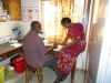 Lab technicians Odit Leonard and Alupo Hellen at work.