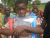 Nabine: A young boy stands with his mosquito nets!