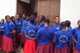 Aya Sec: A group of female students wait outside their dormitories...