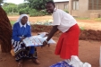 KONGWA-SEC A student presents a net to the Head Mistress of the school.