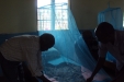 Hombolo: The nets are securely tucked down the sides of the beds to prevent mosquitoes from reaching the children.