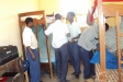 Sepuka & Kinambeu PIC: Workers help students hang their new donated LLINs.