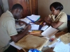Kizaga: The visiting caregivers and the headteacher finalise the distribution plans...