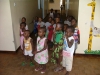 Children at one of the centres watch whilst the distribution takes place.