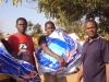 These young men find the receiving of LLIN's a serious business. They are now empowered to safe guard against the sometimes fatal disease of Malaria.